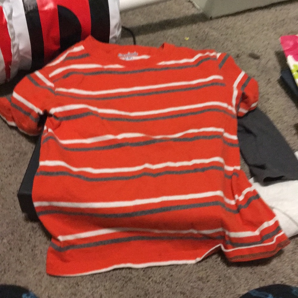 A orange,gray,and white shirt